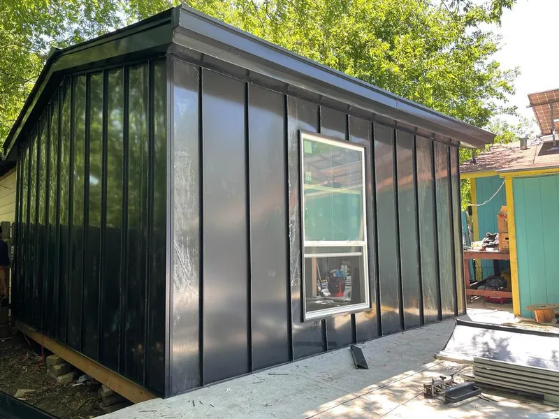 Black standing seam metal wall panels for Roof Inspection in Chicago